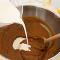 adding cream to the gluten free pumpkin pie filling