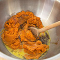 mixing the ingredients for a gluten free pumpkin pie